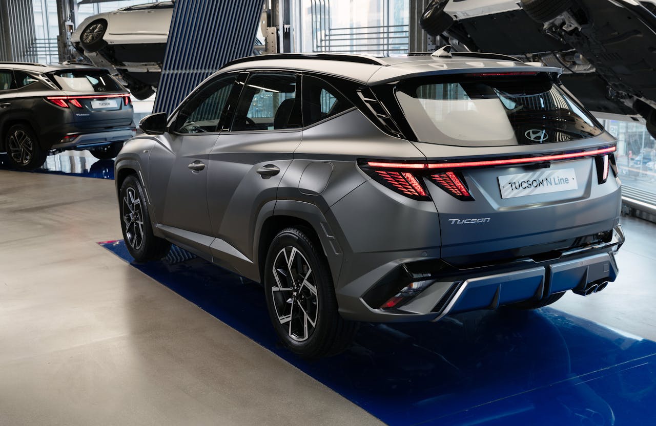 Hyundai Tucson N Line showcased in modern showroom setting with sleek design focus.